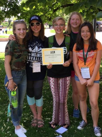 Mackenzie Orr, 18, Editor Lucia Lewis, 18, Editor Bailey Sessions, 18, Trinity Foreman, 20, and Samantha Smith, 21, pose with their award for Best Theme Copy at Rocky Mountain Journalism Camp 2017.  