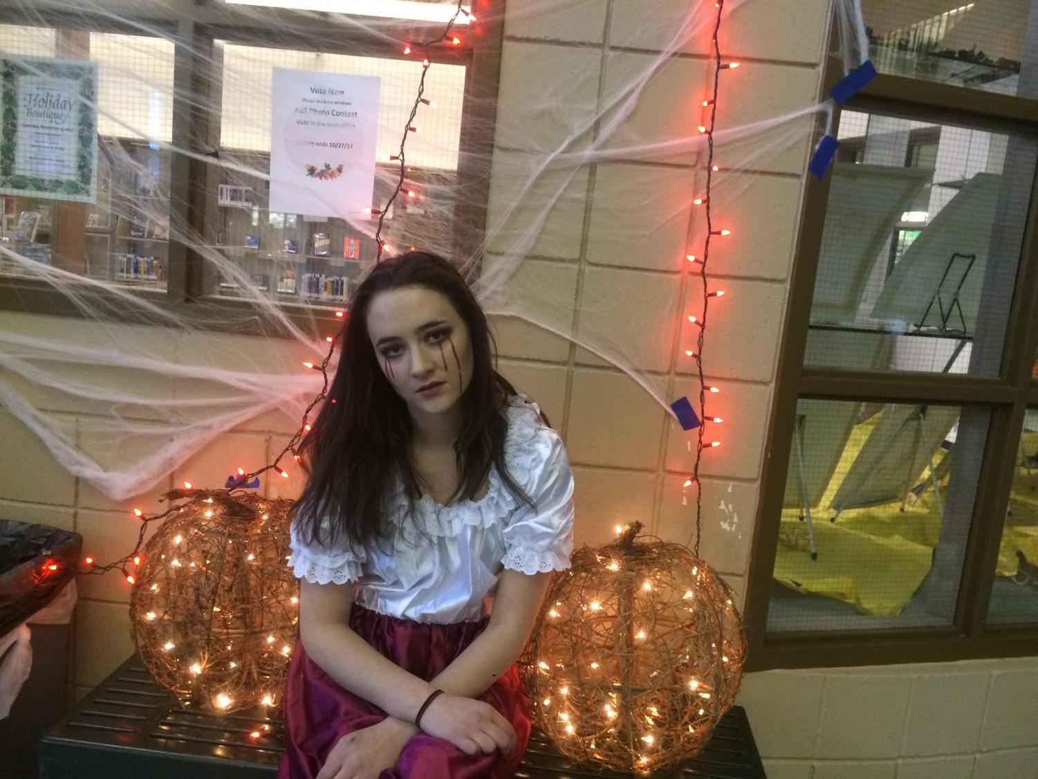 KEY Club president Brenna Nease prepares to head into the haunted house to volunteer, dressed in full vampire get-up. She helped organize and set up the event and greeted attendees on their way into the haunted house.
Photo Courtesy of Parker Jones