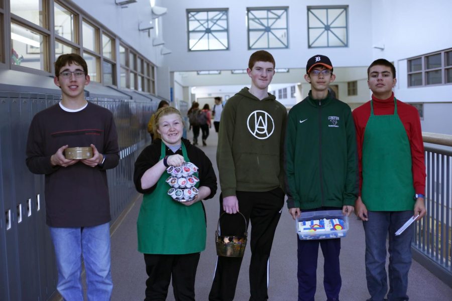 Wyatt Bunch, Maddi Koskinen, Luke Whittington, Joel VanDyne, and Mack Teaff stop for a quick photo between teachers rooms as they collect coffee orders.  Their coffee cart has been up and running for several weeks.  I buy coffee every time they come to see me, Kari Fortik, English teacher, said.