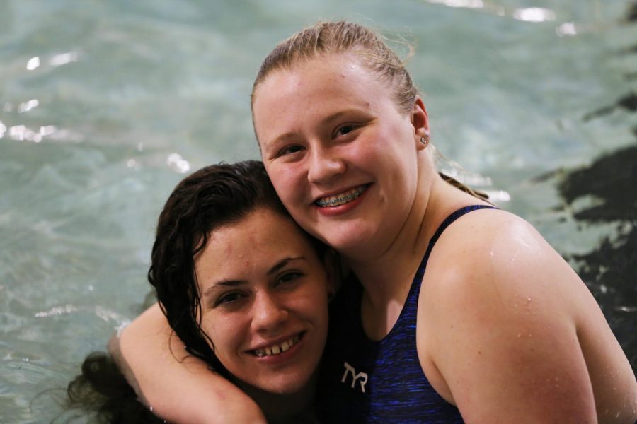 Jana Ley and Junior Maddy Vandergriff stop warm ups to pose for a photo during Jeffco 4A League Prelims on Thursday, February 1.