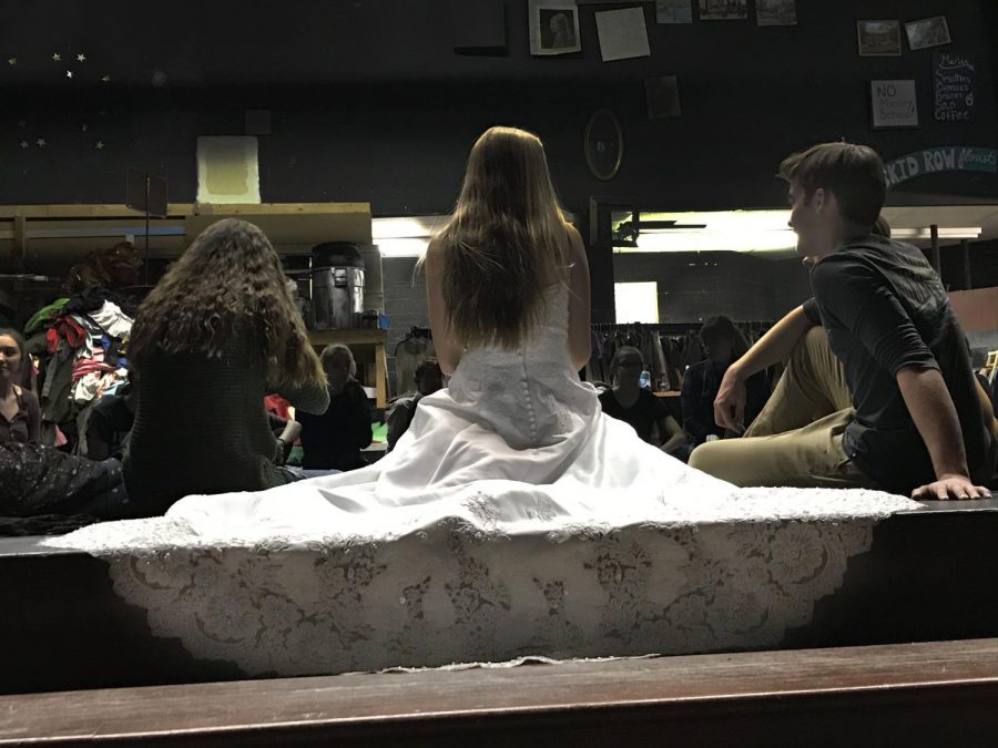 Senior Stella Martin, who plays one of the lead roles, Janet Van De Graff, sits in costume next to her costar, Dylan Roberts.