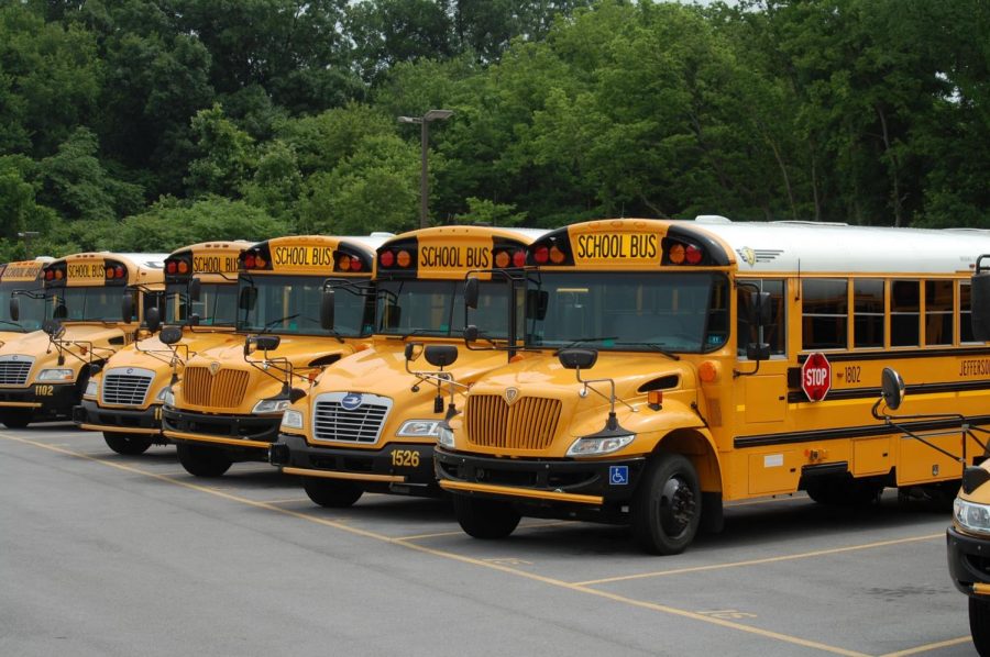 School busses sit idle as the COVID outbreak continues.  Service is expected to resume on October 12.