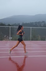 Niya Brandon pushing it for her last lap on the new rubber track.