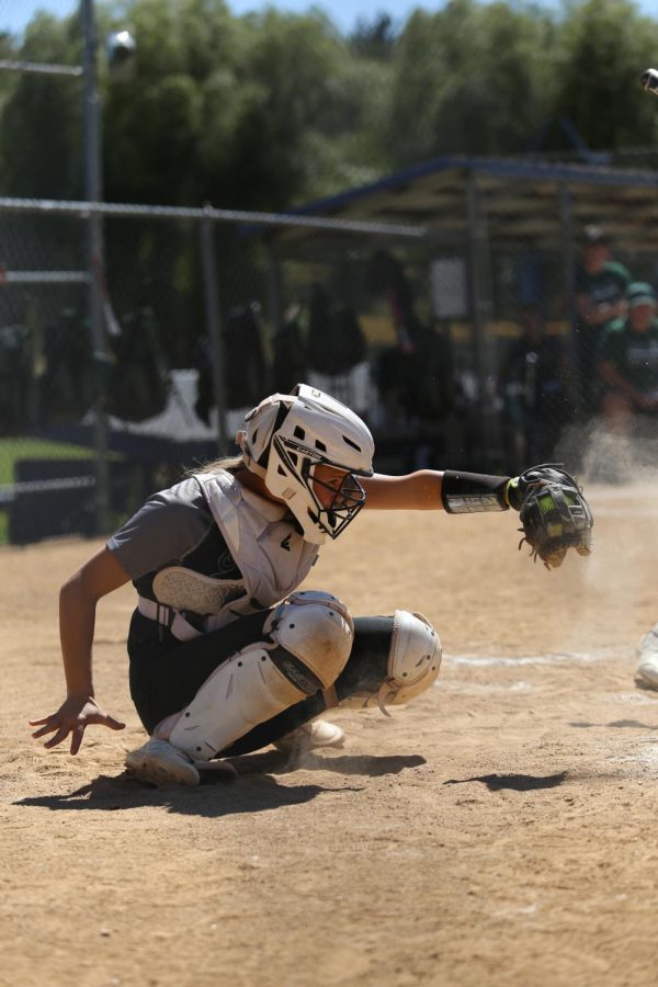 Senior%2C+Megan+Fritz%2C+playing+as+the+catcher.+Megan+Fritz+has+been+playing+softball+for+11+years.+I+stay+focused+by+calling+pitches%2C+Megan+Fritz+said.+It+gives+me+a+say+in+every+play+and+helps+me+concentrate+on+the+game.