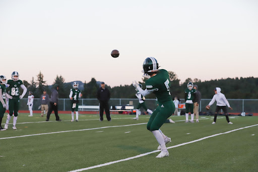 Junior Seth Goodrich warms up for a game earlier in the season against Lewis-Palmer High School.