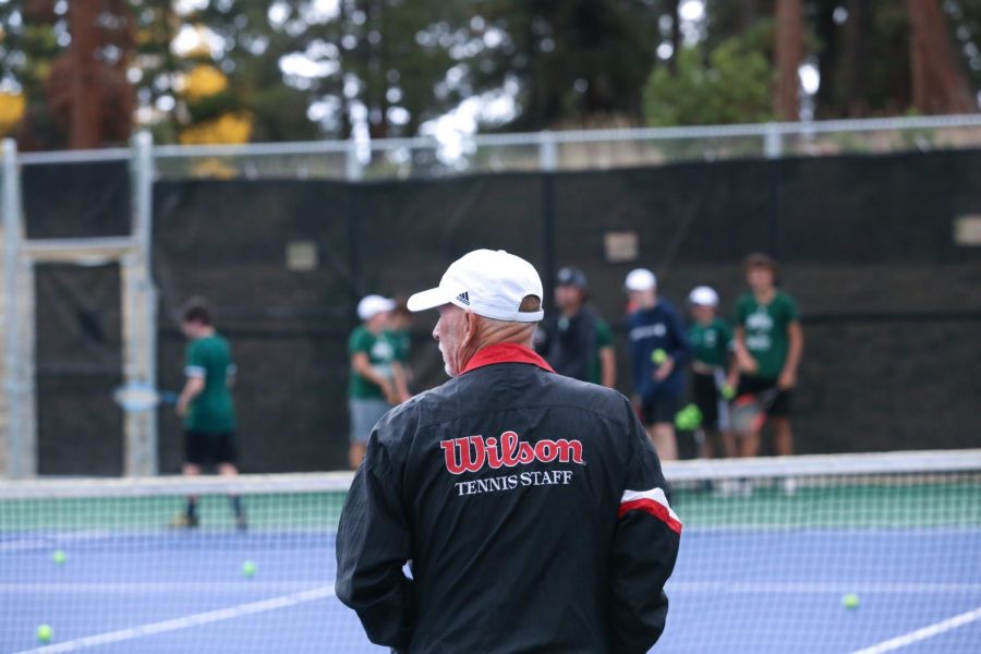 Head coach Ed Doyle walks onto the court during warm-ups at a home game against the Littleton Lions on Oct 4, 2021