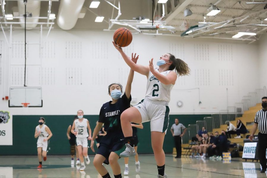 Senior Ana Satchell (#2) goes for a layup against Standley Lake on January 5th