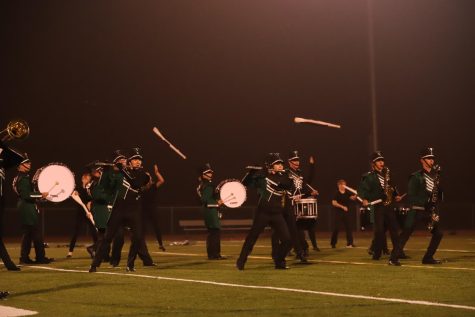 At the beginning of the first movement, the marching band executes their first leaning visual, with the colorguard throwing a double toss in the background. 