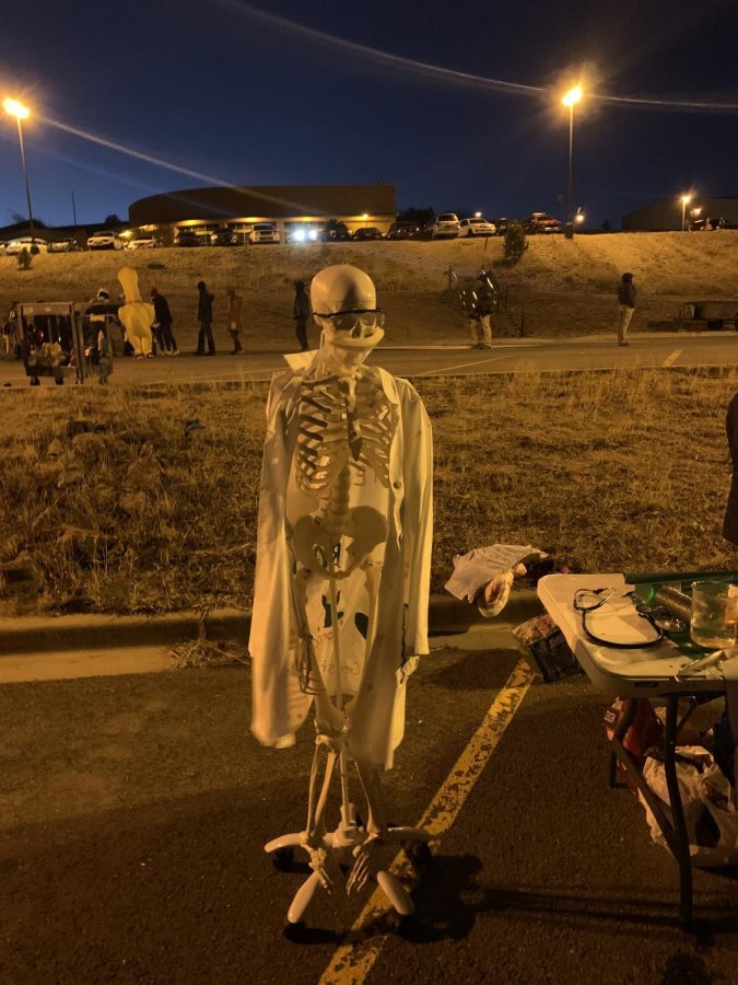 Mr. Bones stands at HOSA’s Trick or Treat Street. Trick or Treat Street takes place every year at Conifer. Clubs set up tables to hand out treats to costumed visitors. 