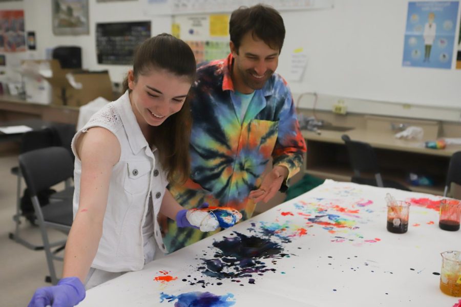 After his AP Chemistry students completed their AP exams, science teacher Brian Bunnell had a tradition of creating tie-dye shirts with the class during finals week. Bunnell and senior Ashley Silvernale (22) shared a laugh as she chose dyes to create her shirt.