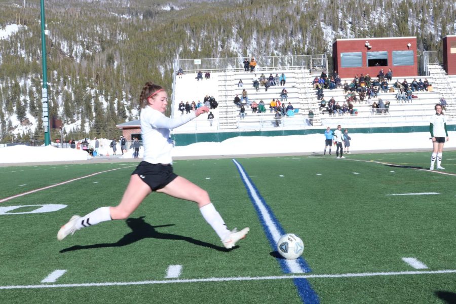 Sophomore+Charlotte+Hood+strikes+at+the+ball.+Hood+is+a+part+time+keeper+for+JV+and+a+field+player.+She+leads+the+team+in+goals+per+match+and+shots.+%0A