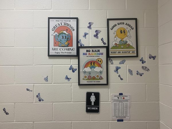The women’s bathroom entrance on the third floor at Conifer High School. The restroom features butterflies, quotes, and other decorations, all a part of the effort to brighten up the school bathrooms. 