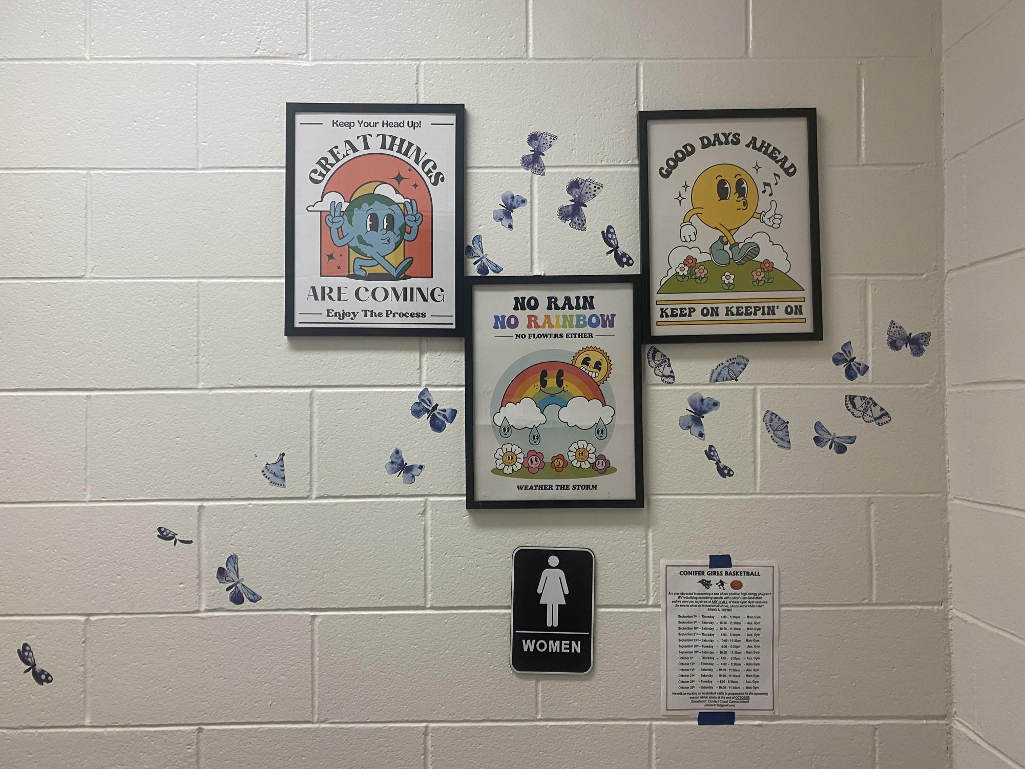 The women’s bathroom entrance on the third floor at Conifer High School. The restroom features butterflies, quotes, and other decorations, all a part of the effort to brighten up the school bathrooms. 