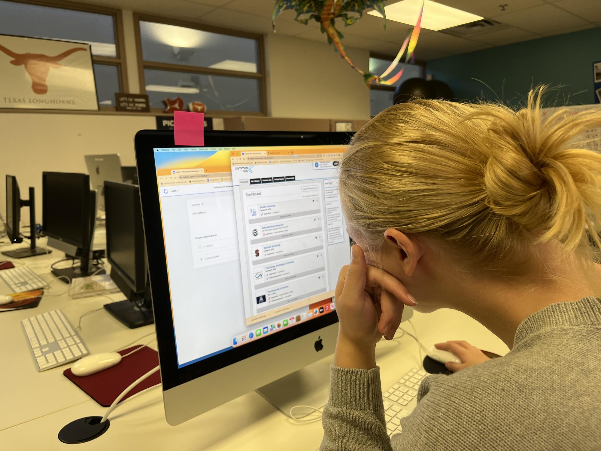 Senior Aly Meyers reviews her college application on a program called Common App that helps her organize the mass of impending deadlines for college. Meyers is applying to 11 colleges while also taking five AP classes and playing varsity volleyball. 