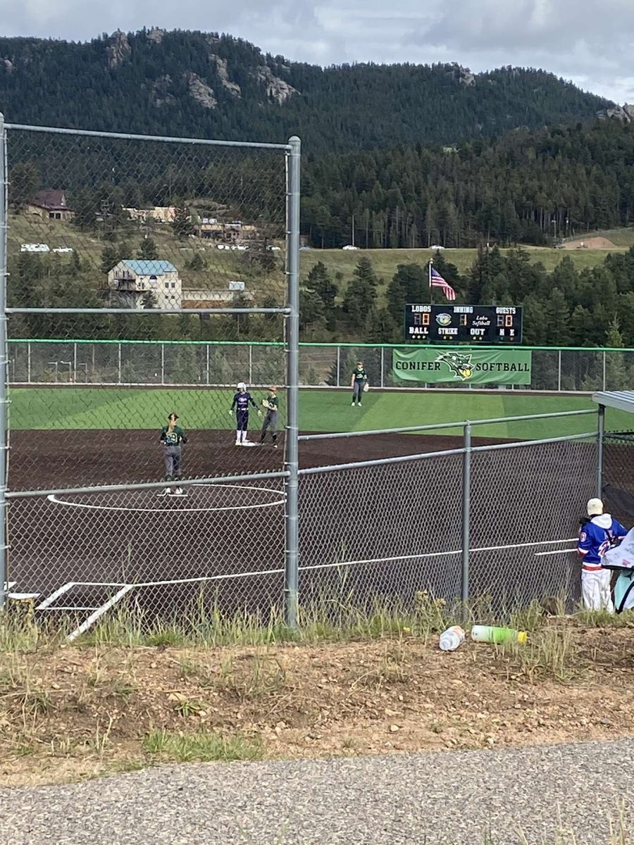 Conifer softball during a home game. “We dont have many fans, honestly. But we have a lot of parents and siblings that come in support. Sometimes we can ask our teachers and they will come but yeah, thats about it,” junior Bella Alley said.