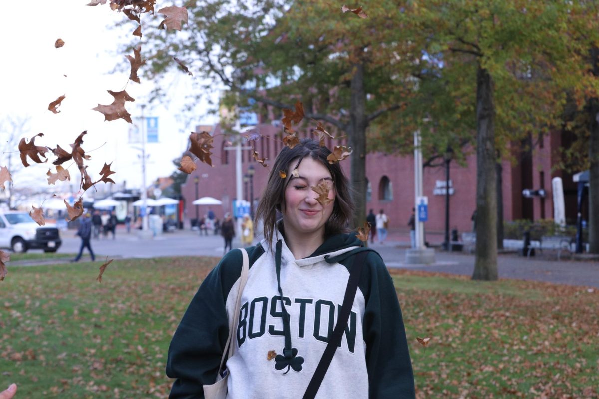 FALLING INTO AUTUMN
The leaves blow into New England in a fall breeze. Senior Isabella Hess finds the perfect day to take a break from the school media trip to Boston, Massachusetts, with her yearbook and media friends to take a nice walk near Long Wharf and admire the city. 

