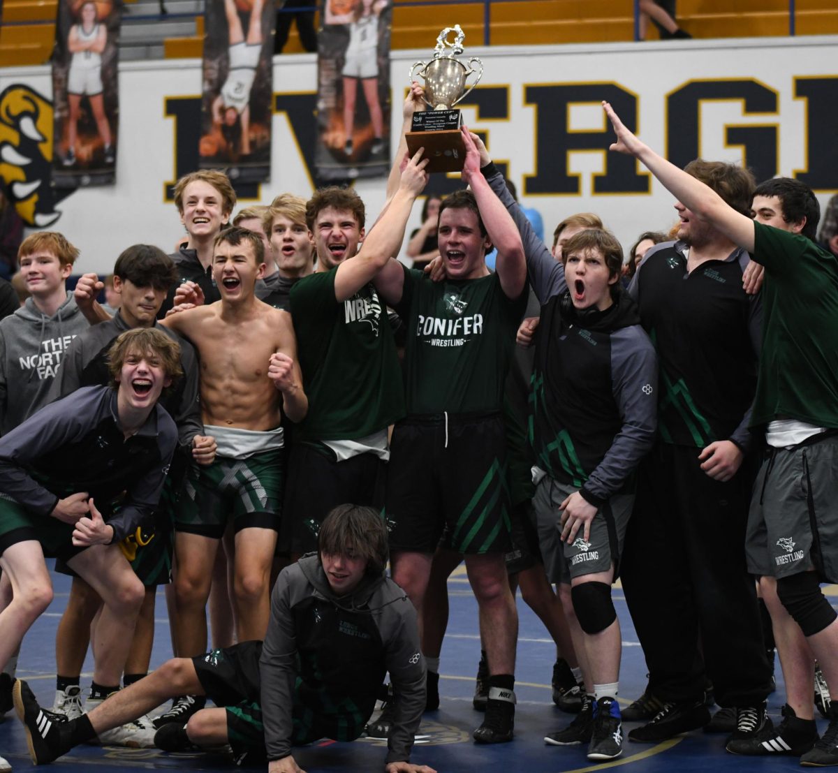 KING OF THE MOUNTAIN
Senior Trace Avery made his mark as one of the captains and brought the rivalry trophy home. It took nine years for the Power Cup to make its way back to Conifer. Avery made the decision to start wrestling his sophomore year and the hard work paid off his senior year.  “I wanted to try something new and wrestling was the perfect thing to try. It is a lot harder than it looks though. We lost to Evergreen so much in years past and it felt great to win with the team that we had this year,” Avery said.
