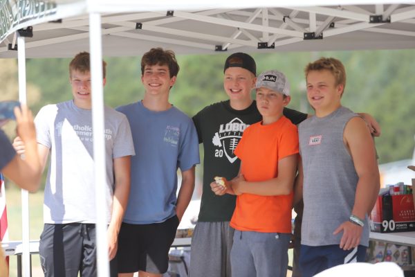 Brodie Maschiangelo (center) stands with his friends and volunteers in front of the table amounted with goods to bring to fire fighters. 
"I'm proud of all these boys that stay to volunteer and help,” Vanessa Maschiangelo said. 

