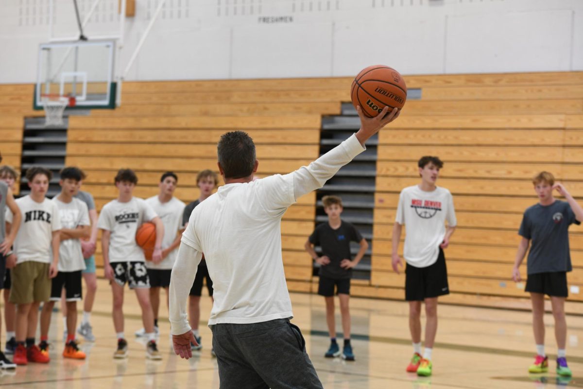 New coach Joshua Templeton surveys the boys basketball team during a preseason training. “I feel great.” Templeton said, “There’s a lot of energy and buzz. I feel like the guys are really excited about basketball, and I’m really excited about coaching.”