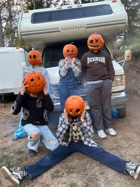 Sophomore Waylon Keane poses with friends during a fall themed photoshoot. For homecoming, Keane plans to go to a party before the dance and get ready with friends.  “I’m not a big dancer, but I want to join a bigger group and make memories at the dance," Keane said. (Photo courtesy of Waylon Keane)
