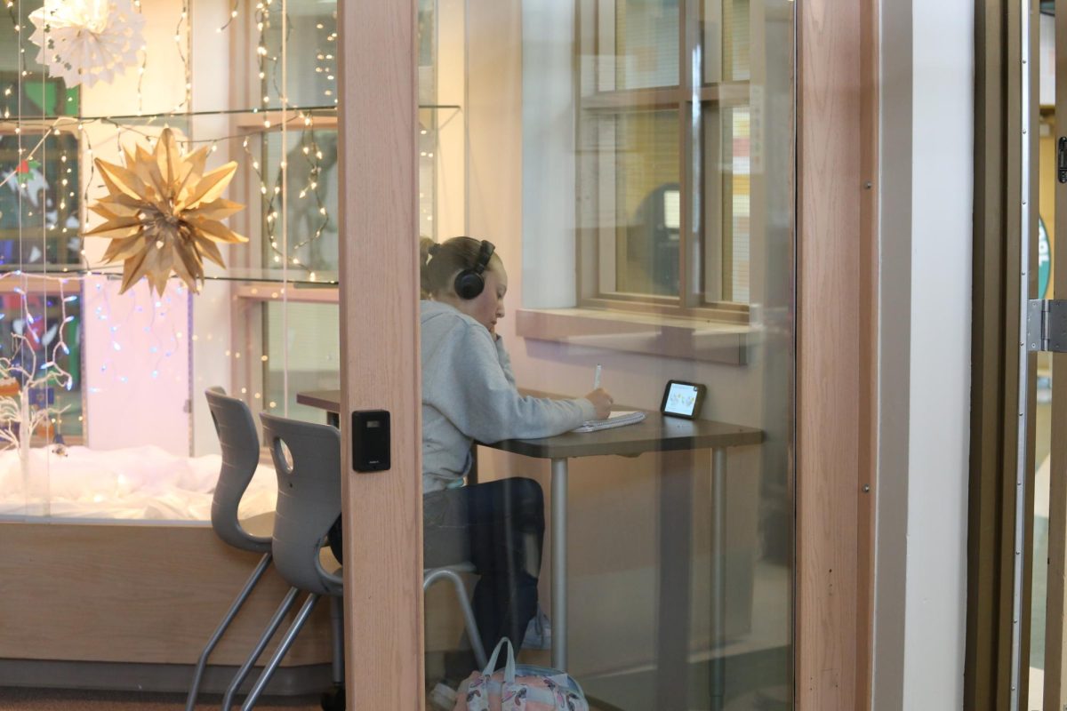 Senior Hannah Norris studies near the entrance of the library. With finals nearing and the library now a school-specific space, students are utilizing the room they have to do classwork and study for exams next week. Students are also studying in the learning center where they can get additional help from teachers and peer tutors. 